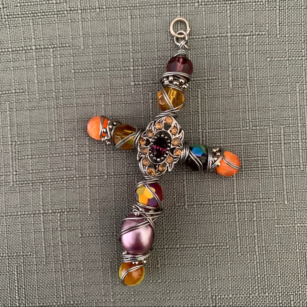 Multi-colored wire and beaded cross.  Unique and very pretty.